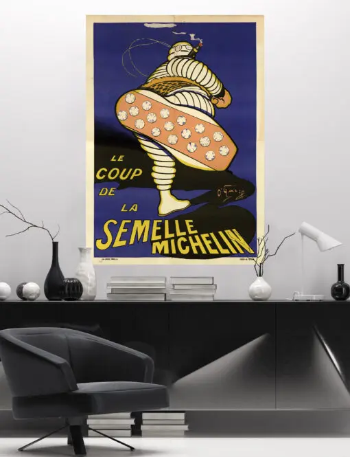 In the sober atmosphere of a modern office, the vintage poster printed on large format adhesive canvas "Le Coup de la Semelle" and its Michelin bibendum, illuminates a wall and wakes up the atmosphere.